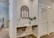 Thumbnail 4 of 12 - Built-in desk in living room at McHenry Square Apartments, Augusta, GA