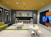Thumbnail 8 of 18 - A modern room with a sofa, chairs, a table, and a television.