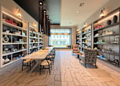 Thumbnail 4 of 18 - A modern interior with a long table and chairs.