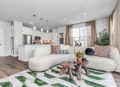 Thumbnail 15 of 37 - Living room and kitchen with wood style flooring and large, energy-efficient windows