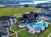 Thumbnail 1 of 37 - An aerial view of The Terrace apartment community with a view of Lake Conroe