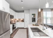 Thumbnail 13 of 37 - Stunning white kitchen with stainless steel appliances