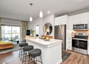 Thumbnail 24 of 37 - Apartment interior with open kitchen and living area