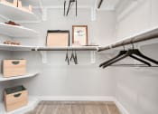 Thumbnail 30 of 37 - Wood shelving in the walk-in closet