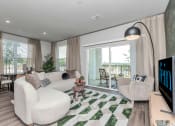 Thumbnail 16 of 37 - Apartment living area with private balcony