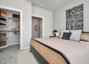 Thumbnail 31 of 37 - A bedroom with luxurious carpeting and door open to a walk-in closet
