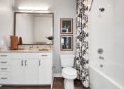 Thumbnail 33 of 37 - Apartment's bathroom with vanity sink