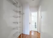 Thumbnail 17 of 18 - a room with white walls and a white ladder in the corner