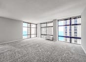 Thumbnail 24 of 36 - an empty living room with a view of the ocean
