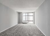 Thumbnail 28 of 36 - an empty room with a large window