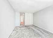 Thumbnail 27 of 36 - a bedroom with grey carpet and white walls