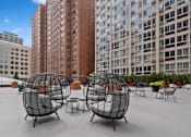 Thumbnail 3 of 45 - a group of chairs sitting on top of a building
