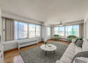 Thumbnail 5 of 27 - a living room with a large window and a couch
