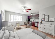 Thumbnail 11 of 37 - a bedroom with a large bed and a ceiling fan