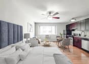 Thumbnail 10 of 37 - a bedroom with a bed and a ceiling fan
