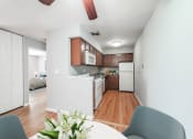 Thumbnail 5 of 28 - a kitchen and dining area in a 555 waverly unit