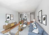 Thumbnail 2 of 28 - a living room with white walls and a blue couch