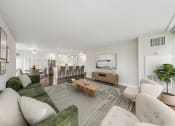 Thumbnail 3 of 62 - a living room with a couch and a table