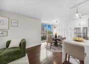 Thumbnail 9 of 62 - a living room with a kitchen and a dining room