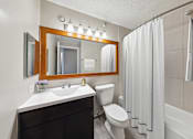 Thumbnail 40 of 53 - the preserve at ballantyne commons apartment bathroom with toilet sink and shower