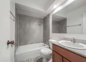 Thumbnail 24 of 28 - a bathroom with a sink toilet and bathtub