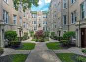 Thumbnail 1 of 24 - a courtyard with a tree in the middle of a building