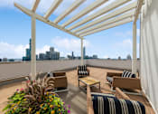 Thumbnail 52 of 53 - a pergola on a roof terrace with a view of the city in the background