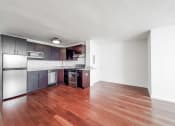 Thumbnail 18 of 43 - a kitchen and living room in a 555 waverly unit