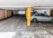Thumbnail 26 of 28 - a car parked in a parking garage