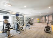 Thumbnail 20 of 29 - a gym with a lot of exercise equipment
