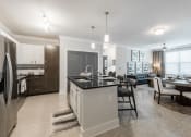 Thumbnail 10 of 29 - a kitchen and dining area in a 555 waverly unit