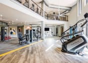 Thumbnail 6 of 29 - a spacious fitness center with treadmills and other exercise equipment
