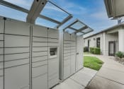 Thumbnail 30 of 39 - a pergola with a dog kennel attached to the side of a house at Highland Luxury Living Apartments, Lewisville