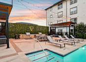 Thumbnail 51 of 53 - pool with a slide and sun loungers at Vine + Vail Townhomes and Apartments, Grapevine