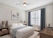 Thumbnail 5 of 69 - A bedroom with a large bed and a ceiling fan at Highline Urban Lofts Apartments, Cypress 77429