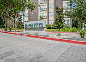 Thumbnail 46 of 48 - A sign that says Evergreen Midtown Park in front of a building at Everra Midtown Park Apartments, Dallas, Texas