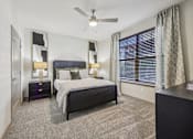 Thumbnail 8 of 53 - bedroom with nightstand at Vine + Vail Townhomes and Apartments, Texas, 76051