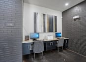 Thumbnail 30 of 69 - A room with a desk and two computers at Highline Urban Lofts Apartments, Cypress