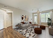 Thumbnail 18 of 69 - A living room with a couch, chair, and ottoman at Highline Urban Lofts Apartments, Texas, 77429