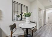 Thumbnail 45 of 53 - dining room with a white table at Vine + Vail Townhomes and Apartments, Grapevine Texas