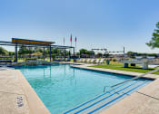 Thumbnail 18 of 39 - Swimming Pool With Relaxing Sundecks at Highland Luxury Living, Texas, 75067