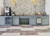 Thumbnail 46 of 53 - kitchen with a checkered floor at Vine + Vail Townhomes and Apartments, Grapevine
