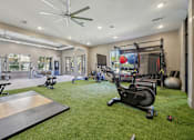 Thumbnail 30 of 53 - Gym wit green floor at Vine + Vail Townhomes and Apartments, Grapevine