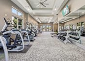 Thumbnail 32 of 53 - spacious gym with treadmills at Vine + Vail Townhomes and Apartments, Texas, 76051