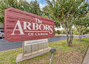 Thumbnail 4 of 17 - Property entrance monument sign with landscaping at Arbors Of Cleburne Apartments, Cleburne, TX