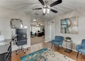 Thumbnail 30 of 40 - Office space with modern furniture and colorful artwork at Arbors Of Corsicana Apartments, Texas, 75110