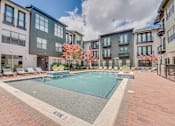 Thumbnail 28 of 53 - Resort style swimming pool with sundeck at The Barton Apartments, Dallas