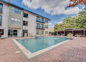 Thumbnail 33 of 53 - Outdoor pool area with spa and paver deck at The Barton Apartments, Texas, 75206
