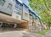 Thumbnail 52 of 53 - Resident parking garage entrance with street view at The Barton Apartments, Dallas, TX