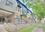 Thumbnail 48 of 53 - Modern apartment exterior with landscaped entrance at The Barton Apartments, Dallas, 75206